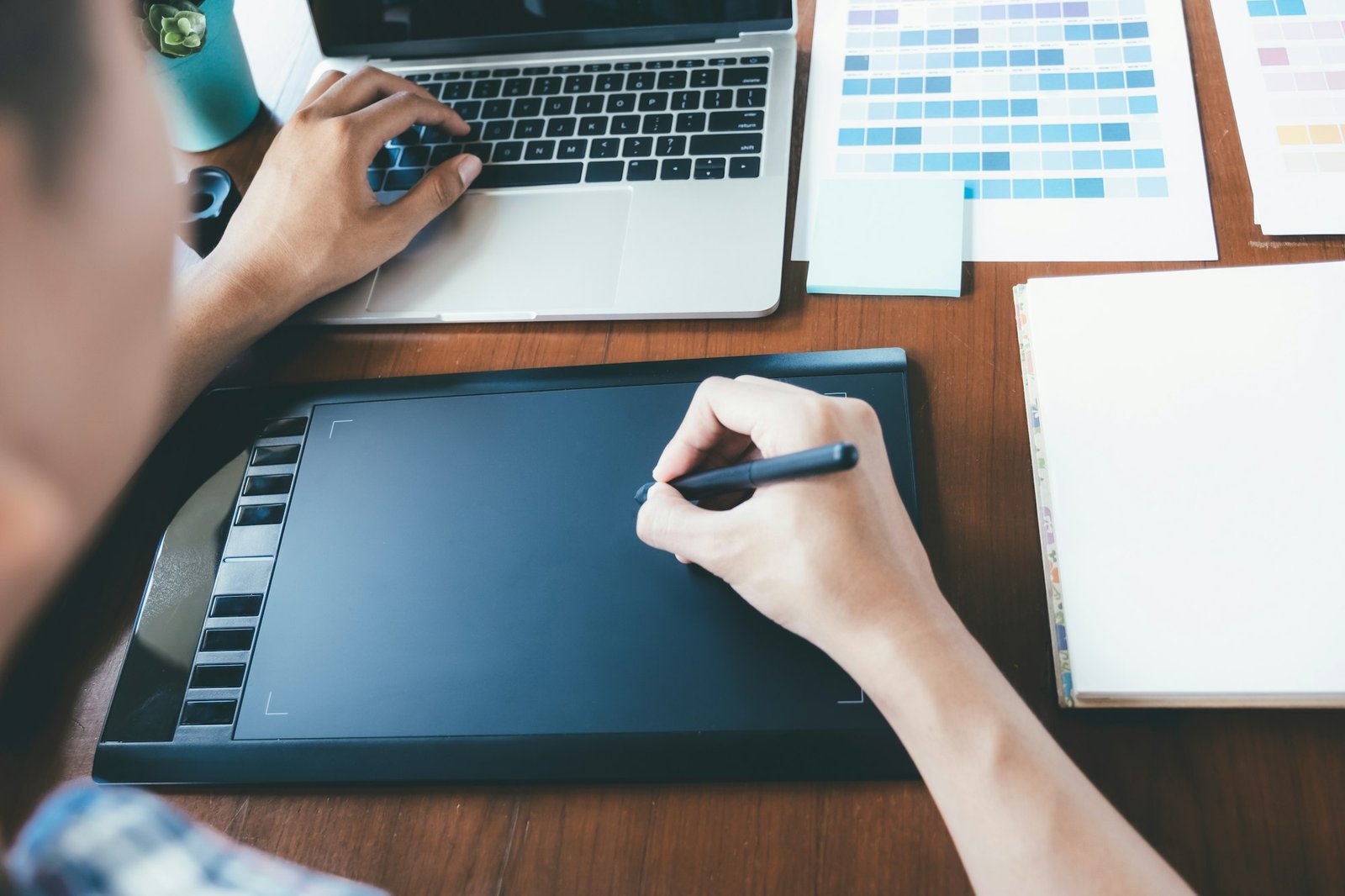 Graphic designer using digital tablet